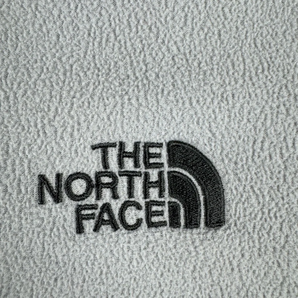 The North Face men’s Gray and Black Logo lightweight 1/4 zip Fleece